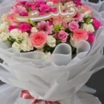 Blossom Grandeur – Lush Pink & Cream Mixed Bouquet in White Cloud Wrap