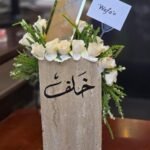 Alabaster Garden – Elegant White Rose Arrangement in Architectural Stone Base