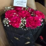 Midnight Magenta – Vibrant Rose Bouquet in Golden-Leaf Black Mesh