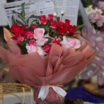 Vintage Verse – Classic Rose Bouquet with Newsprint Accents
