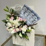 Majestic Blessings – Luxury White Rose & Lily Garden with Saudi Riyal Accents