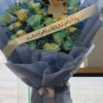 Mother's Eternal Love – Blue-Mist Rose Bouquet with Mother & Child Keepsake