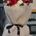 Midnight Contrast – Bold Red & White Rose Bouquet in Elegant Mesh Wrap
