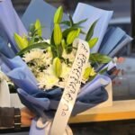 Azure Serenity – Pristine White Lily & Chrysanthemum Bouquet in Sky Blue Wrap